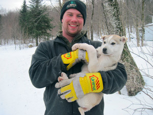 Joe and a sled dog puppy